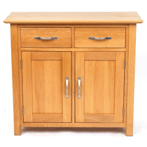2070 - A modern oak side cabinet fitted with two drawers above cupboards on stile supports, 77cm H x 85cm W... 