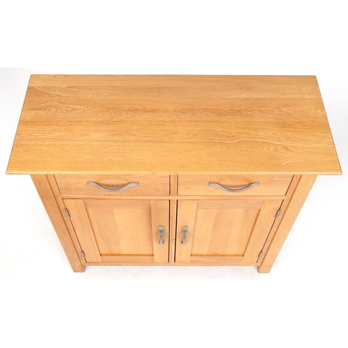 2070 - A modern oak side cabinet fitted with two drawers above cupboards on stile supports, 77cm H x 85cm W... 