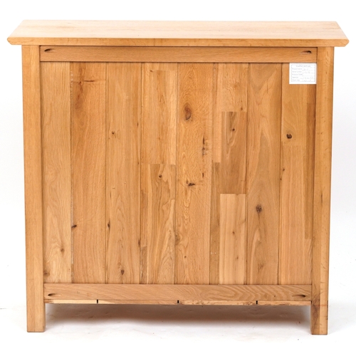 2070 - A modern oak side cabinet fitted with two drawers above cupboards on stile supports, 77cm H x 85cm W... 