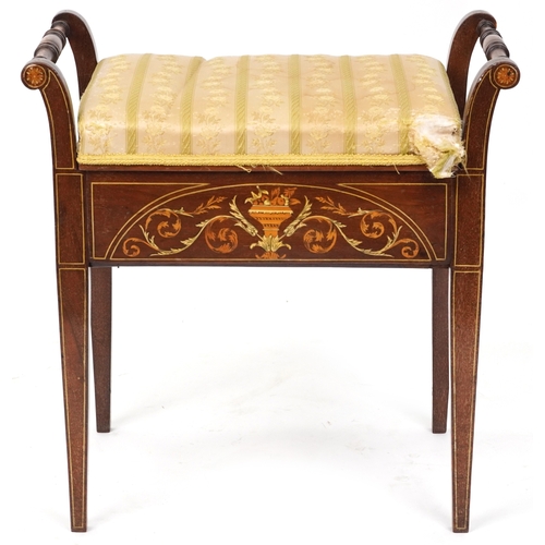 2183 - A late Victorian mahogany piano stool, the overstuffed hinged seat above an inlaid panel, raised on ... 