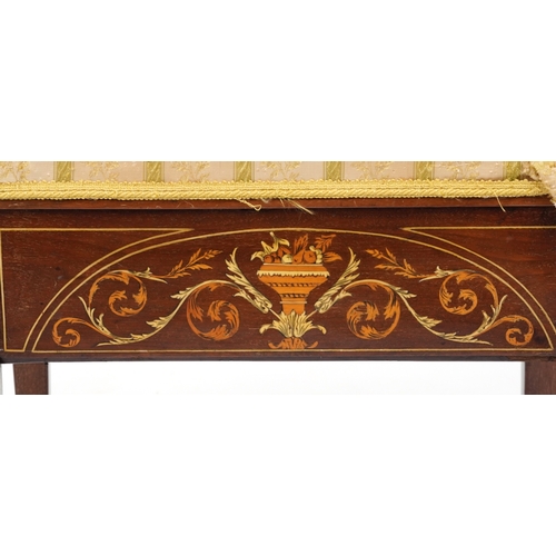 2183 - A late Victorian mahogany piano stool, the overstuffed hinged seat above an inlaid panel, raised on ... 