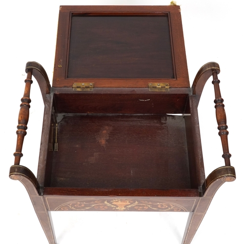 2183 - A late Victorian mahogany piano stool, the overstuffed hinged seat above an inlaid panel, raised on ... 