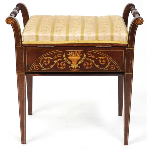 2183 - A late Victorian mahogany piano stool, the overstuffed hinged seat above an inlaid panel, raised on ... 
