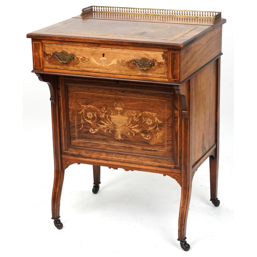2104 - A late Victorian rosewood desk with inlaid decoration, the gilt metal gallery back above a drawer, o... 