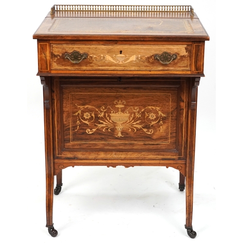2104 - A late Victorian rosewood desk with inlaid decoration, the gilt metal gallery back above a drawer, o... 
