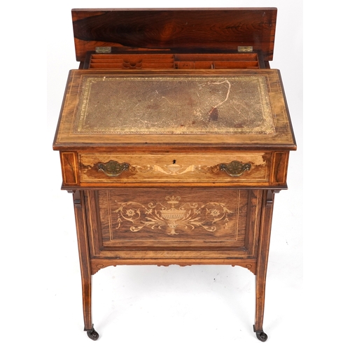 2104 - A late Victorian rosewood desk with inlaid decoration, the gilt metal gallery back above a drawer, o... 