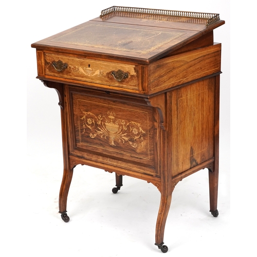 2104 - A late Victorian rosewood desk with inlaid decoration, the gilt metal gallery back above a drawer, o... 