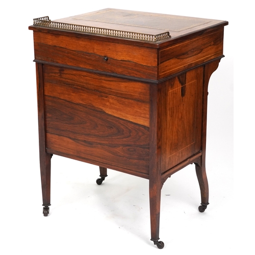 2104 - A late Victorian rosewood desk with inlaid decoration, the gilt metal gallery back above a drawer, o... 