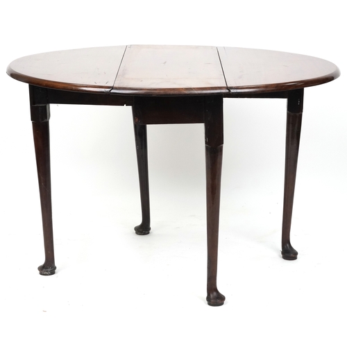 2040 - A late George III mahogany drop flap dining table raised on turned tapering legs and pad feet, 70cm ... 
