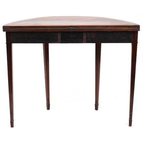 2041 - A late George III mahogany demi lune fold over card table raised on square tapering legs, 73cm H x 9... 