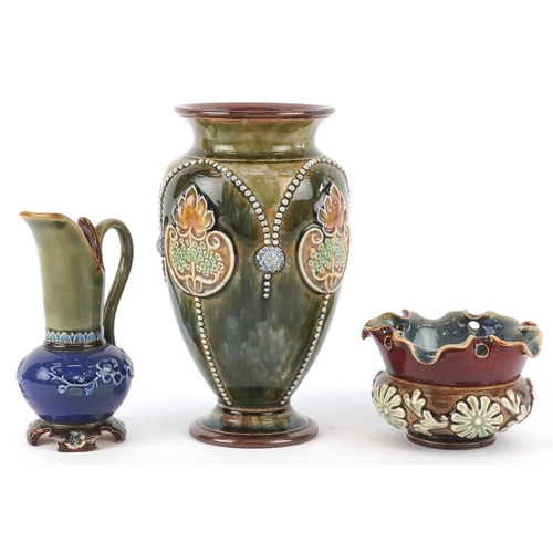 327 - Doulton Lambeth, Art Nouveau stoneware comprising a vase ewer and a pot, the largest 17.5cm high.