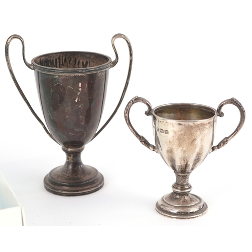 3641 - Antique and later silver comprising two twin handled trophies, a Dutch caddy spoon and set of 830 gr... 