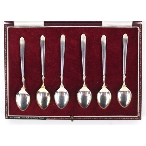 3612 - Cohen & Charles, a set of six silver and guilloche enamel teaspoons hand painted with flowers, house... 