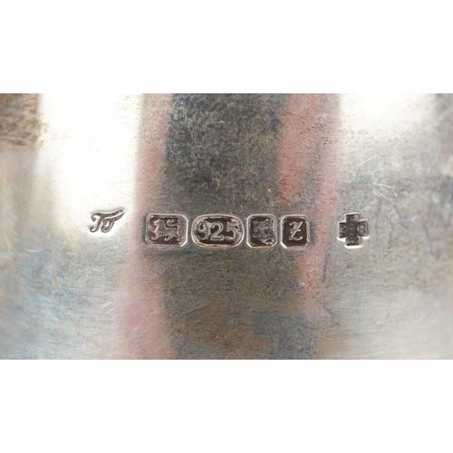 3572 - Trevor Towner, a pair of Arts & Crafts style silver candlesticks, London 2000, 5.5cm high, total 277... 