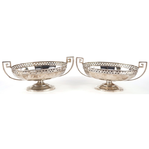 3611 - Roberts & Belk Ltd., a pair of George V silver pedestal sweetmeat dishes having twin handles and pie... 