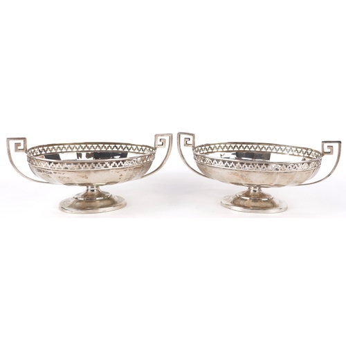 3611 - Roberts & Belk Ltd., a pair of George V silver pedestal sweetmeat dishes having twin handles and pie... 