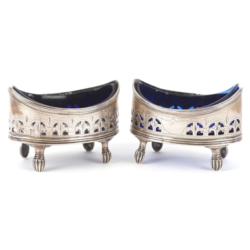 3619 - Charles Fox II, a pair of George III silver open table salts with blue glass liners and pierced deco... 