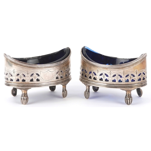 3619 - Charles Fox II, a pair of George III silver open table salts with blue glass liners and pierced deco... 