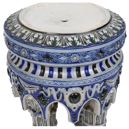 488 - An early 20th century German Westerwald stoneware jardinière stand, the circular top raised on four ... 