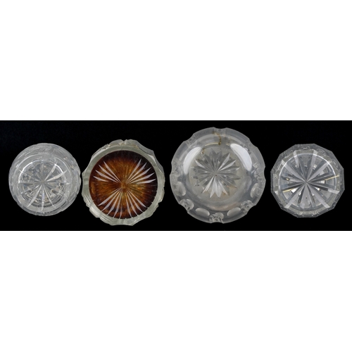 1714 - A group of four cut glass decanters and two silver decanter labels, the largest 35cm high