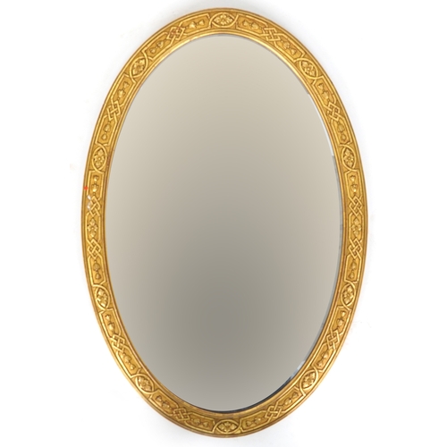 2174 - A 20th century gilt framed oval wall mirror, 97cm x 65cm.