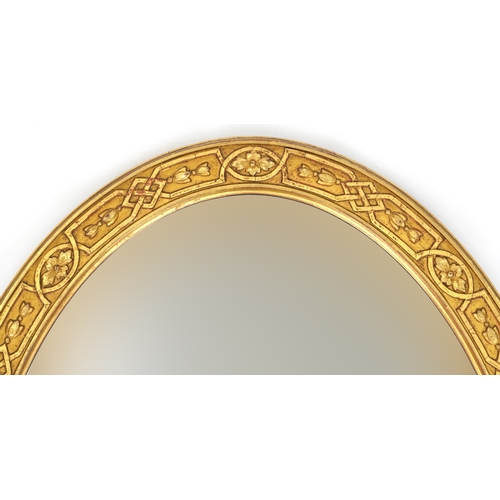 2174 - A 20th century gilt framed oval wall mirror, 97cm x 65cm.