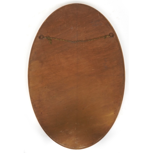 2174 - A 20th century gilt framed oval wall mirror, 97cm x 65cm.
