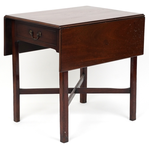 2037 - An late George III mahogany drop flap side table fitted with a drawer, raised on block legs united b... 