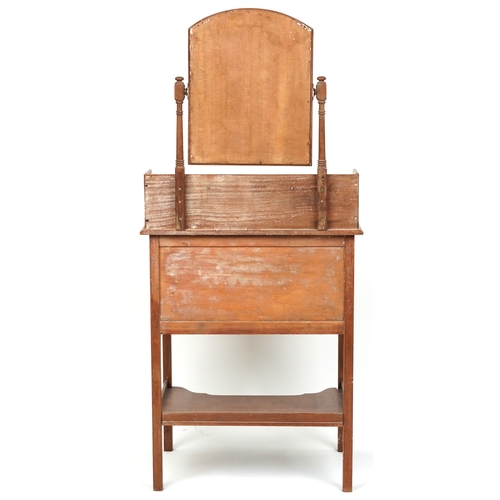 2078 - An early 20th century mahogany dressing chest fitted with a swing frame mirror above two drawers and... 