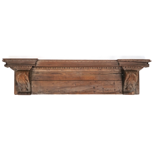 2096 - An 18th century oak and pine architectural pediment with stiff leaf scroll supports, 42cm H x 185cm ... 