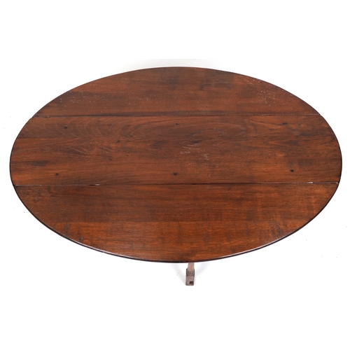 2080 - A 20th century oak drop flap coffee table raised on turned and block supports, 48cm H x 123cm W x 90... 