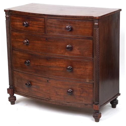 2038 - An early 19th century mahogany bow front chest of two short and three graduated long drawers, on tur... 