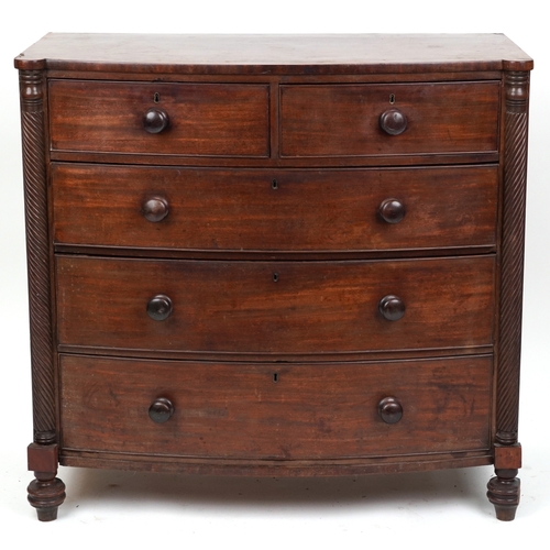 2038 - An early 19th century mahogany bow front chest of two short and three graduated long drawers, on tur... 