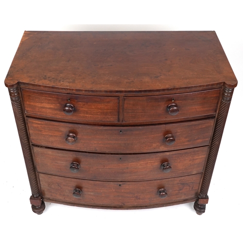 2038 - An early 19th century mahogany bow front chest of two short and three graduated long drawers, on tur... 
