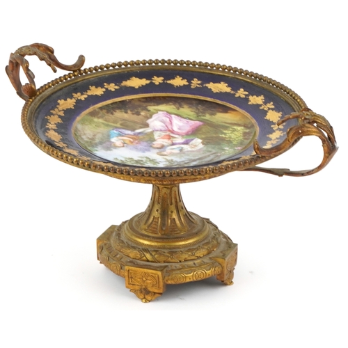 523 - Manner of Sèvres, a 19th century ormolu and porcelain pedestal tazza hand painted with children play... 