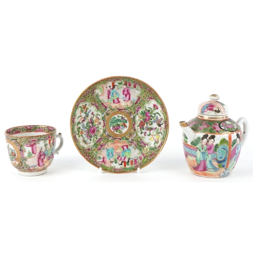 93 - Chinese Canton porcelain comprising a teapot, teacup and saucer, each finely hand painted in the fam... 
