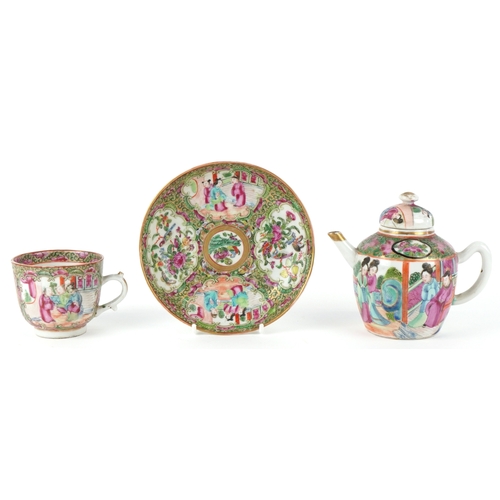 93 - Chinese Canton porcelain comprising a teapot, teacup and saucer, each finely hand painted in the fam... 