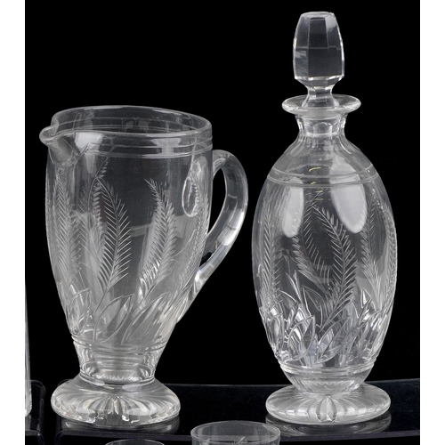 1729 - A collection of cut crystal glassware etched with leaves comprising three Stuart Crystal decanters a... 