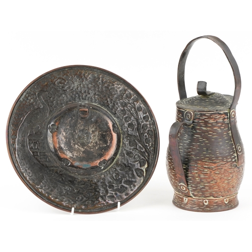 211 - An Keswick style Arts & Crafts copper plate and an Arts & Crafts copper jug, the largest 28cm high.
