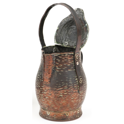 211 - An Keswick style Arts & Crafts copper plate and an Arts & Crafts copper jug, the largest 28cm high.