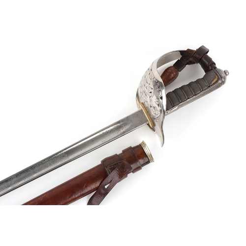 2858 - A British military Henry Wilkinson sword having engraved steel blade and wire bound shagreen grip, w... 