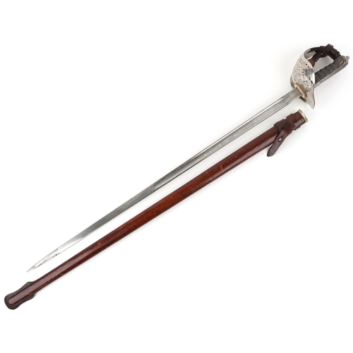 2858 - A British military Henry Wilkinson sword having engraved steel blade and wire bound shagreen grip, w... 