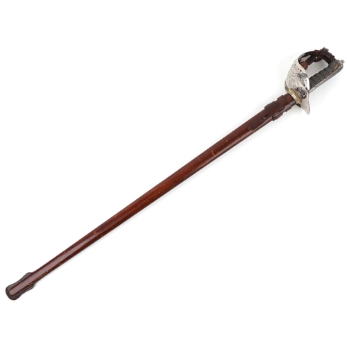 2858 - A British military Henry Wilkinson sword having engraved steel blade and wire bound shagreen grip, w... 