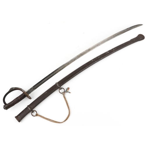 2860 - An American military interest Civil War steel bladed sword and scabbard with turned wooden grip, the... 
