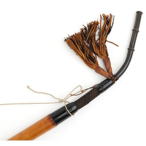 1482 - A 20th century German malacca and china smoking pipe, the bowl decorated Paderborn 1912, 90cm in len... 