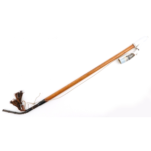 1482 - A 20th century German malacca and china smoking pipe, the bowl decorated Paderborn 1912, 90cm in len... 