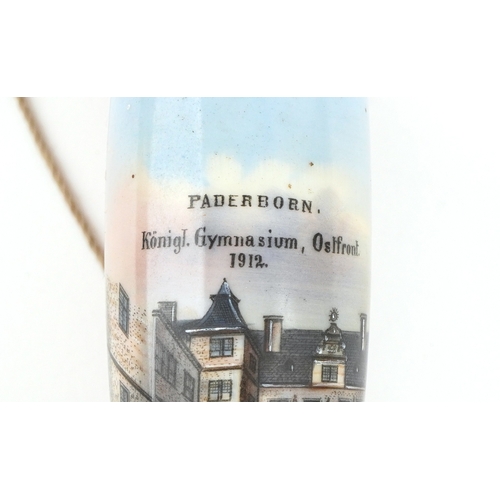 1482 - A 20th century German malacca and china smoking pipe, the bowl decorated Paderborn 1912, 90cm in len... 