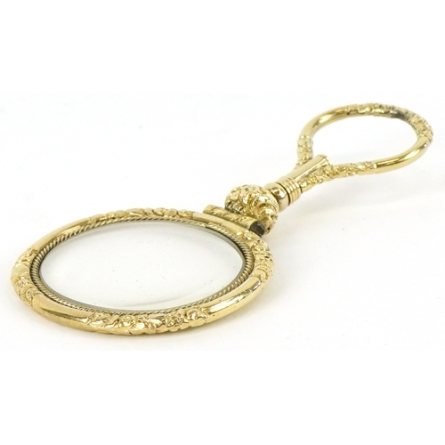 301 - A 19th century gold plated quizzing glass, 7.1cm high.