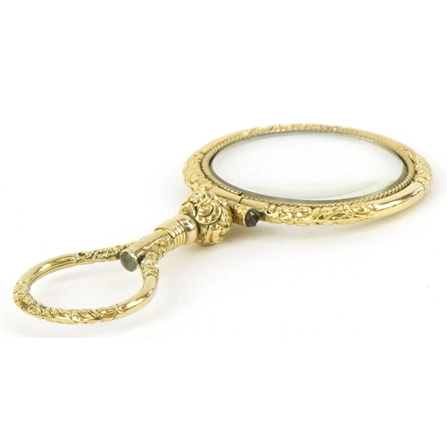 301 - A 19th century gold plated quizzing glass, 7.1cm high.