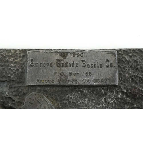 1845 - Two vintage American cast metal belt buckles including an enamelled rhinoceros example, the largest ... 